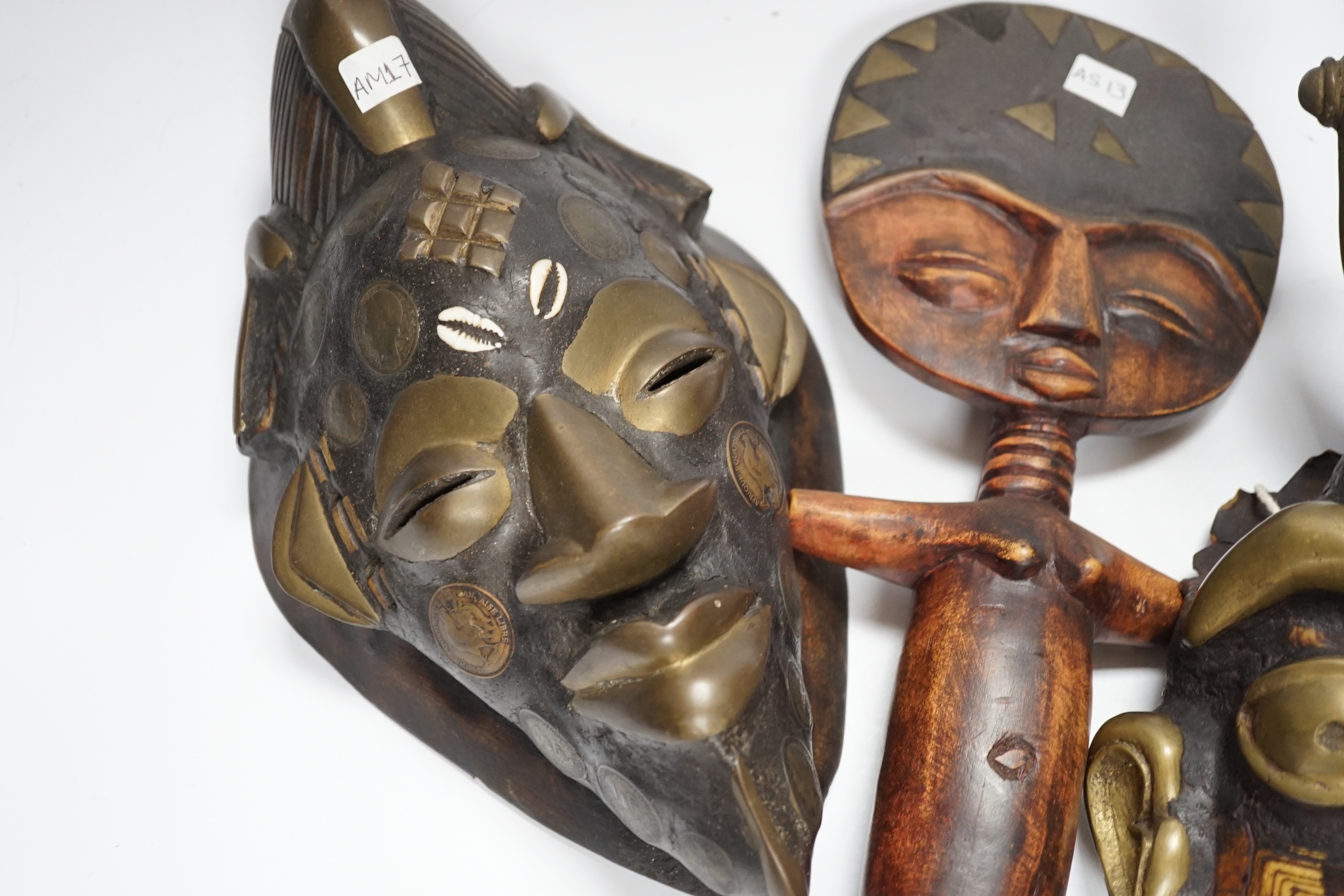 Two Lega tribal masks one made from a tortoise shell and an Ashanti fertility figure, tallest 32.5cm
